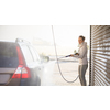 Woman washing her car in a manual carwash (color toned image)