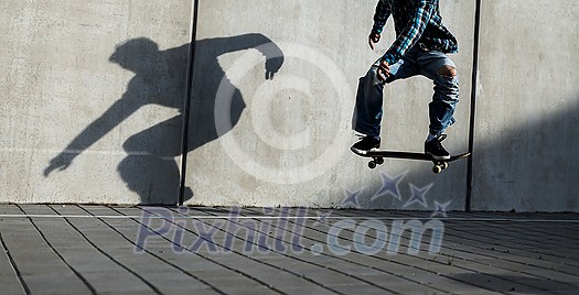 Skateboarder riding fast towards the ramps to be lifted into the air and perform a trick Skateboarder riding fast towards the ramps to be lifted into the air and perform a trick