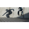 Skateboarder riding fast towards the ramps to be lifted into the air and perform a trick