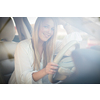 Pretty, young woman  driving a car -Invitation to travel. Car rental or vacation.
