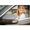Pretty, young woman  driving a car -Invitation to travel. Car rental or vacation.