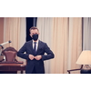 corporate business man wearing protective medical face mask at luxury office