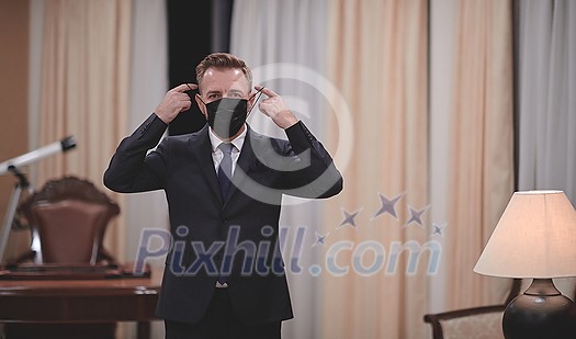 corporate business man wearing protective medical face mask at luxury office corporate business man wearing protective medical face mask at luxury office