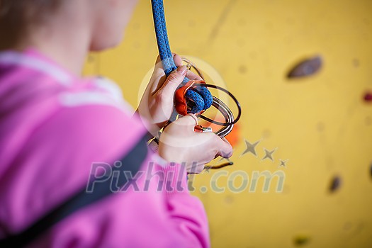 People climbing in indoor climbing gym People climbing in indoor climbing gym