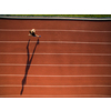 Shot of a young male athlete training on a race track. Sprinter running on athletics tracks seen from above