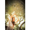 Attractive, young brunette on the beach, amid olive trees, looking both sensual and natural