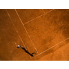 Female tennis player on the court. Wide angle view from above with plenty of copyspace