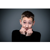 Grief-stricken little boy - feeling intense sorrow, remorse, sadnesss - studio portrait - vivid emotions series