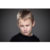 Grief-stricken little boy - feeling intense sorrow, remorse, sadnesss - studio portrait - vivid emotions series