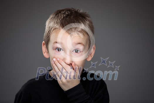 Grief-stricken little boy - feeling intense sorrow, remorse, sadnesss - studio portrait - vivid emotions series