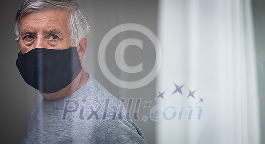 Senior man wearing a facemask during coronavirus and flu outbreak. Virus and illness protection, home quarantine. COVID-19 concept Senior man wearing a facemask during coronavirus and flu outbreak. Virus and illness protection, home quarantine. COVID-19 concept