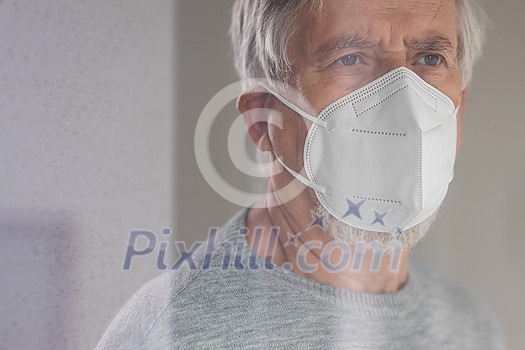 Senior man wearing a facemask during coronavirus and flu outbreak. Virus and illness protection, home quarantine. COVID-19 concept Senior man wearing a facemask during coronavirus and flu outbreak. Virus and illness protection, home quarantine. COVID-19 concept