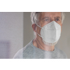 Senior man wearing  a facemask during coronavirus and flu outbreak. Virus and illness protection, home quarantine. COVID-19 concept