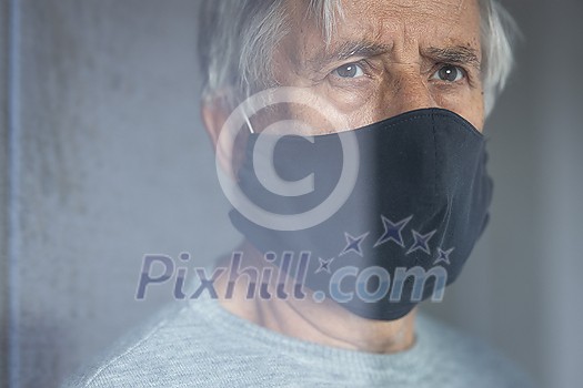 Senior man wearing a facemask during coronavirus and flu outbreak. Virus and illness protection, home quarantine. COVID-19 concept Senior man wearing a facemask during coronavirus and flu outbreak. Virus and illness protection, home quarantine. COVID-19 concept