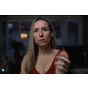 Mid-aged woman lighting a cigarette at home, getting her nicotine daily dose, unable to resist to her unhealthy habit