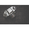 Old retro camera on vintage wooden boards abstract background with lens, close-up photo of old camera lens, image is retro filtered, selective focus