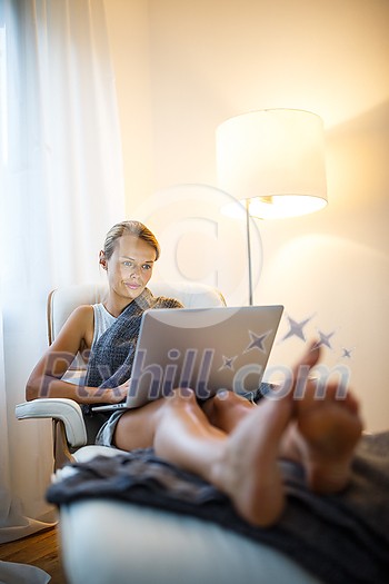 Pretty, young woman working from home during a pandemic coronavirus crisis Pretty, young woman working from home during a pandemic coronavirus crisis