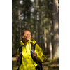 Pretty, young female hiker walking through a splendid old forest (shallow DOF)