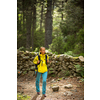 Pretty, young female hiker walking through a splendid old forest (shallow DOF)