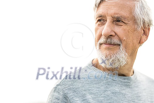 Portrait of a senior man outdoors, against the sky - optimism, good health, happyness radiates of the man's face, expression