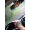 Handsome young driver driving hic car fast yet safely on the road