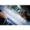 Handsome young driver driving hic car fast yet safely on the road