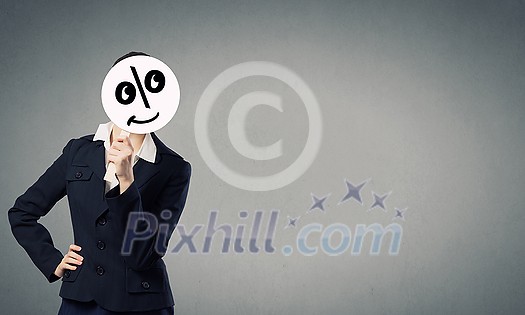 Unrecognizable businesswoman hiding her face behind mask Unrecognizable businesswoman hiding her face behind mask