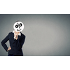 Unrecognizable businesswoman hiding her face behind mask