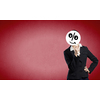 Unrecognizable businesswoman hiding her face behind mask