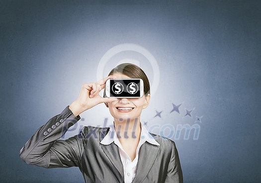 Beautiful young woman holding mobile phone against her eyes Beautiful young woman holding mobile phone against her eyes