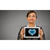 Beautiful young woman holding tablet pc with love heart