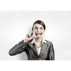 Beautiful young woman holding mobile phone against her mouth and smiling