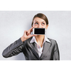 Beautiful young woman holding mobile phone against her mouth and smiling