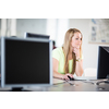 Pretty, female student looking at a desktop computer screen, learning unpleasant news about her exam results. University/office/school concept