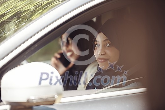 Arabic Woman Couple Traveling By Luxury Car in Saudy Arabia Arabic Woman Couple Traveling By Luxury Car in Saudy Arabia