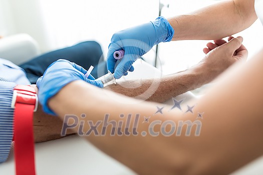 Covid-19 testing - Senior man having a blood test done by a nurse Covid-19 testing - Senior man having a blood test done by a nurse