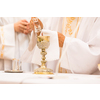 Priest during a wedding ceremony/nuptial mass (shallow DOF; color toned image)