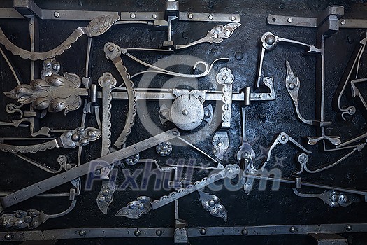 Lock mechanism from the inside on an historic strongbox/vault - very complex and beautiful apparatus Lock mechanism from the inside on an historic strongbox/vault - very complex and beautiful apparatus