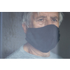 Senior man wearing  a facemask during coronavirus and flu outbreak. Virus and illness protection, home quarantine. COVID-19 concept