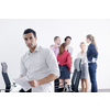 Confident young business man attending a meeting with his colleagues