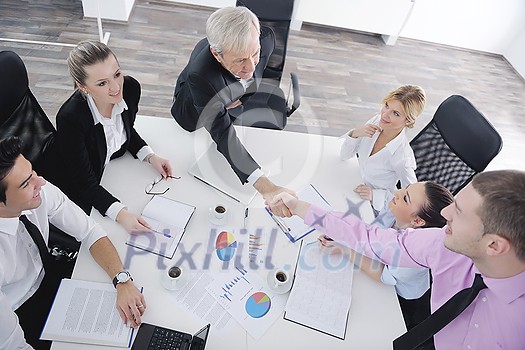 business people team at a meeting in a light and modern office environment. business people team at a meeting in a light and modern office environment.