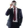 Portrait of a business man holding and catch falling money bills, isolated on white background in studio