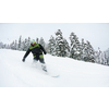 Snowboarder doing a jump and free ride on  powder snow at winter season