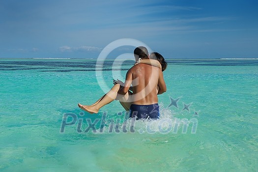 happy young asian couple enjoying summer and have on beautiful white sand beach happy young asian couple enjoying summer and have on beautiful white sand beach