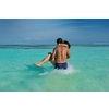 happy young asian couple enjoying summer and have on beautiful white sand beach
