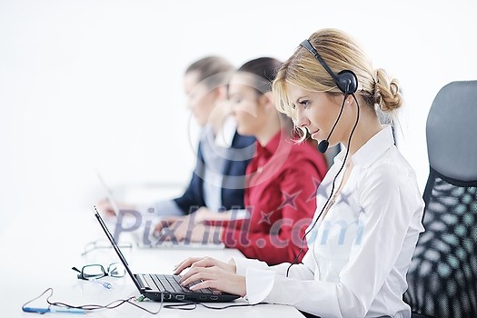 Pretty young business woman group with headphones smiling at you against white background Pretty young business woman group with headphones smiling at you against white background