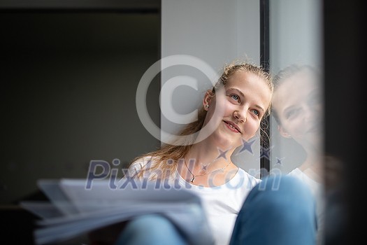 Cute female university/highschool student with books in library Cute female university/highschool student with books in library