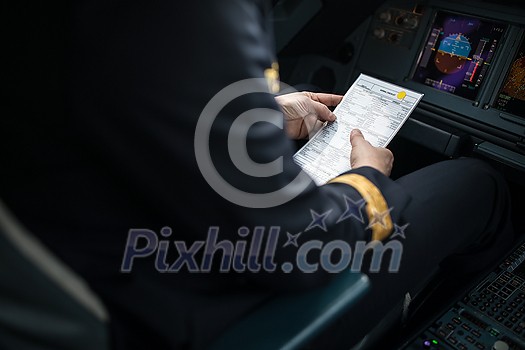 Pilot's hand accelerating on the throttle in a commercial airliner airplane flight cockpit during takeoff Pilot's hand accelerating on the throttle in a commercial airliner airplane flight cockpit during takeoff