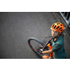Pretty, young woman with her mountain bike going for a ride past the city limits, getting the daily cardio dose