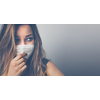 Young woman wearing a face mask during coronavirus and flu outbreak. Virus and illness protection, home quarantine. COVID-19 concept